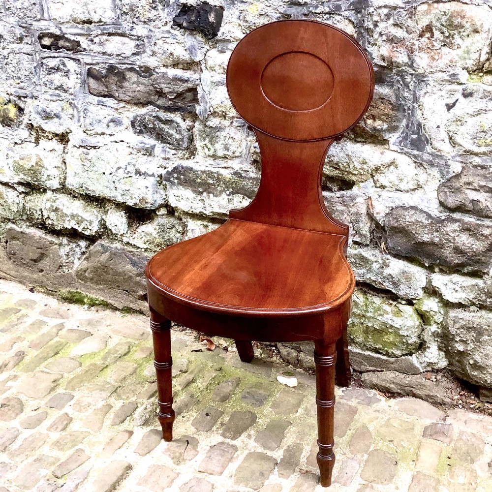 A George III mahogany hall chair 