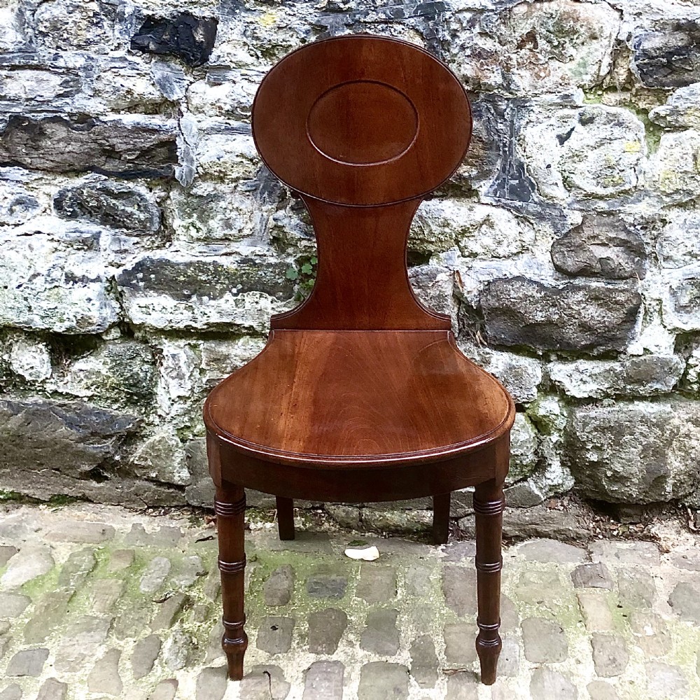 A George III mahogany hall chair  View II