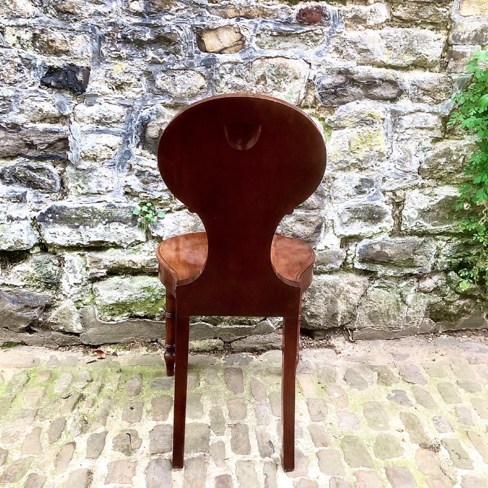 A George III mahogany hall chair  View VIII