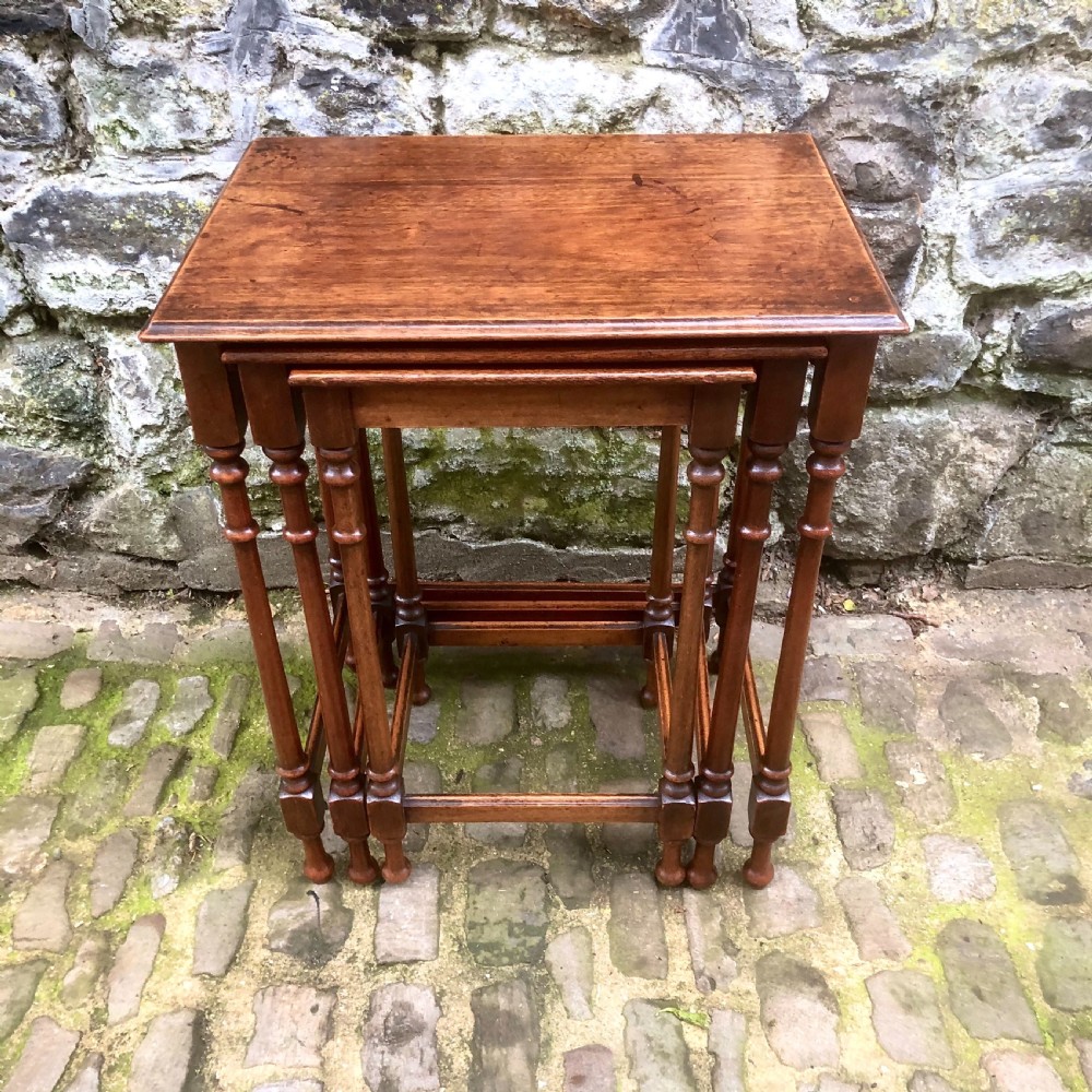 A late 19th century mahogany nest of three tables 