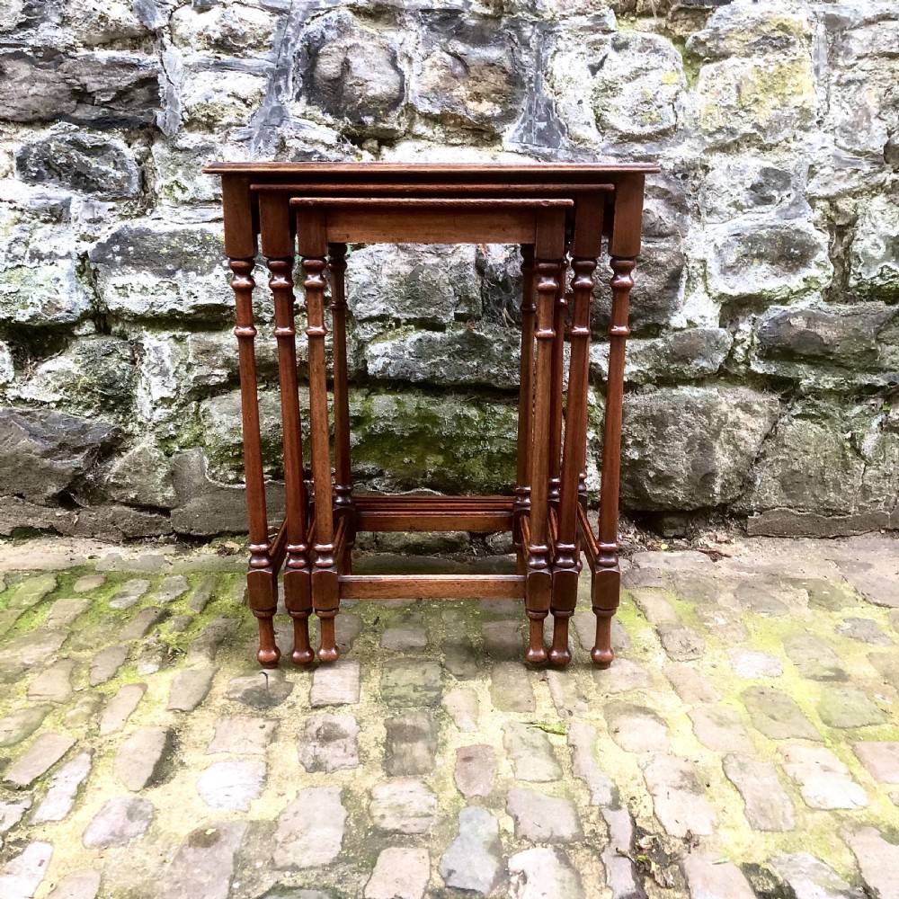 A late 19th century mahogany nest of three tables  View II