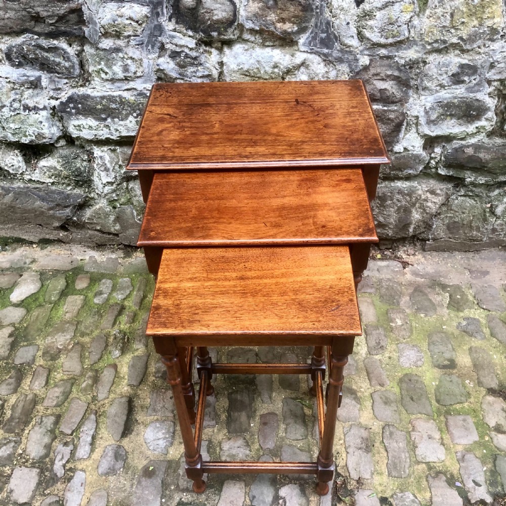 A late 19th century mahogany nest of three tables  View V