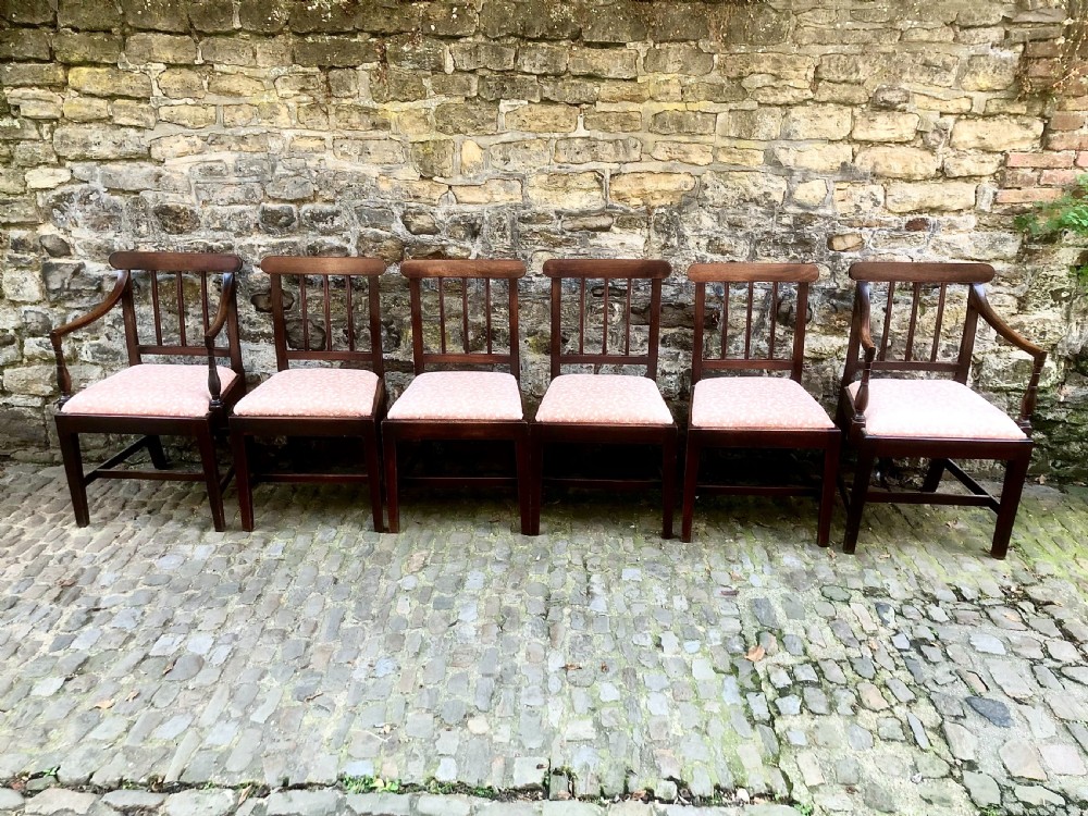A set of six George III mahogany dining chairs 