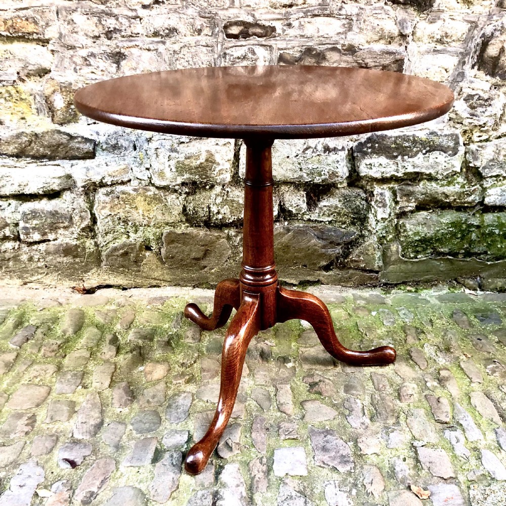 A George III oak tripod pedestal tilt-top table View II