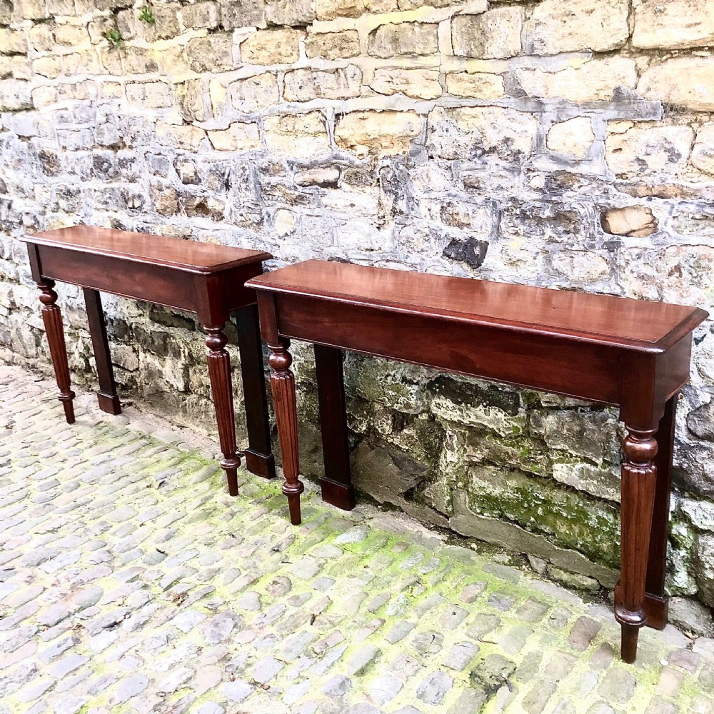 A pair of early Victorian mahogany console tables View II