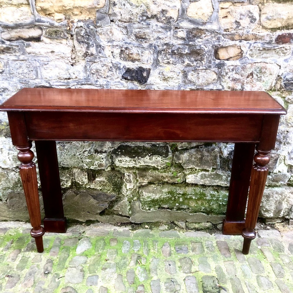 A pair of early Victorian mahogany console tables View III