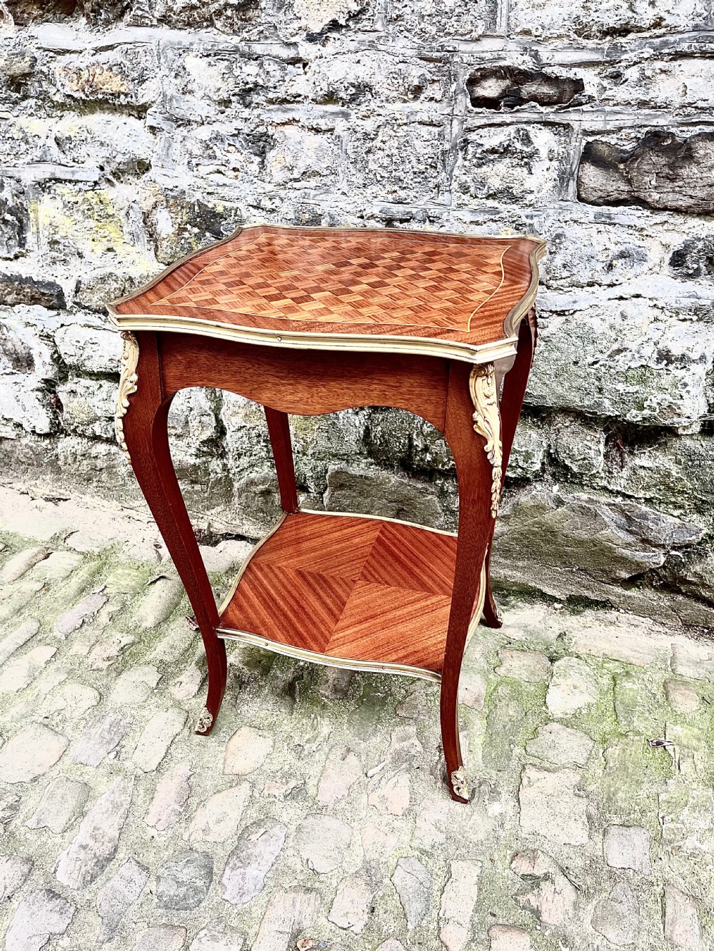 A late 19th century French kingwood lamp table