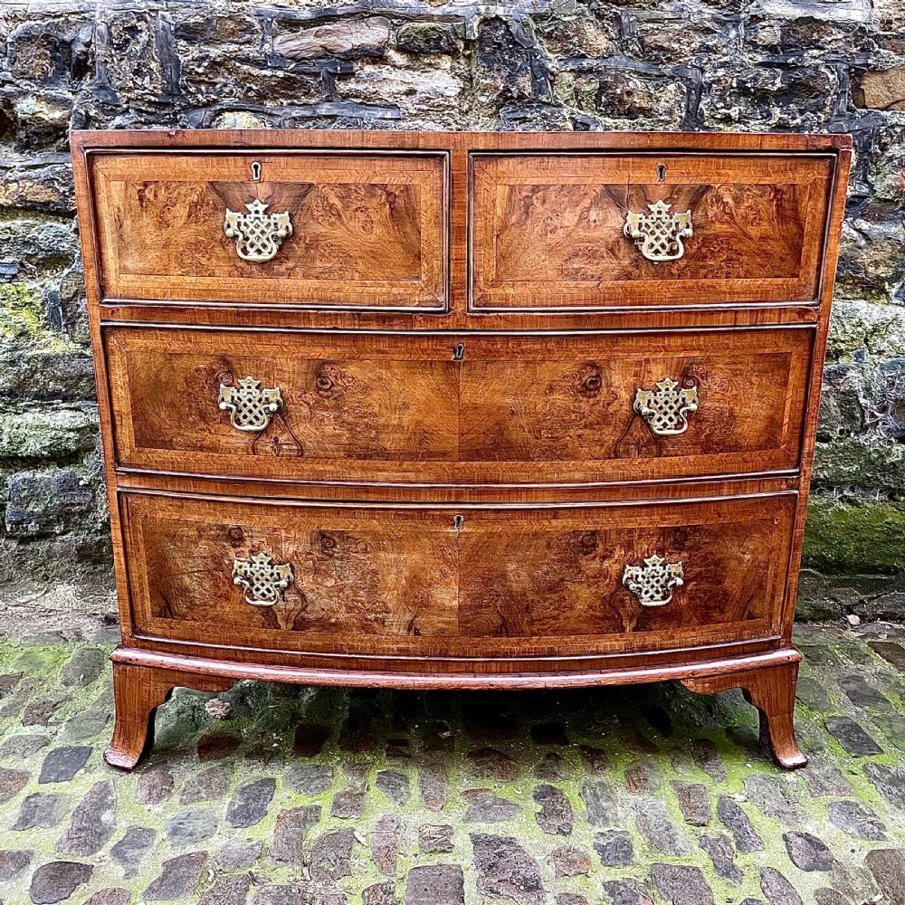 A Regency walnut bowfront chest of drawers