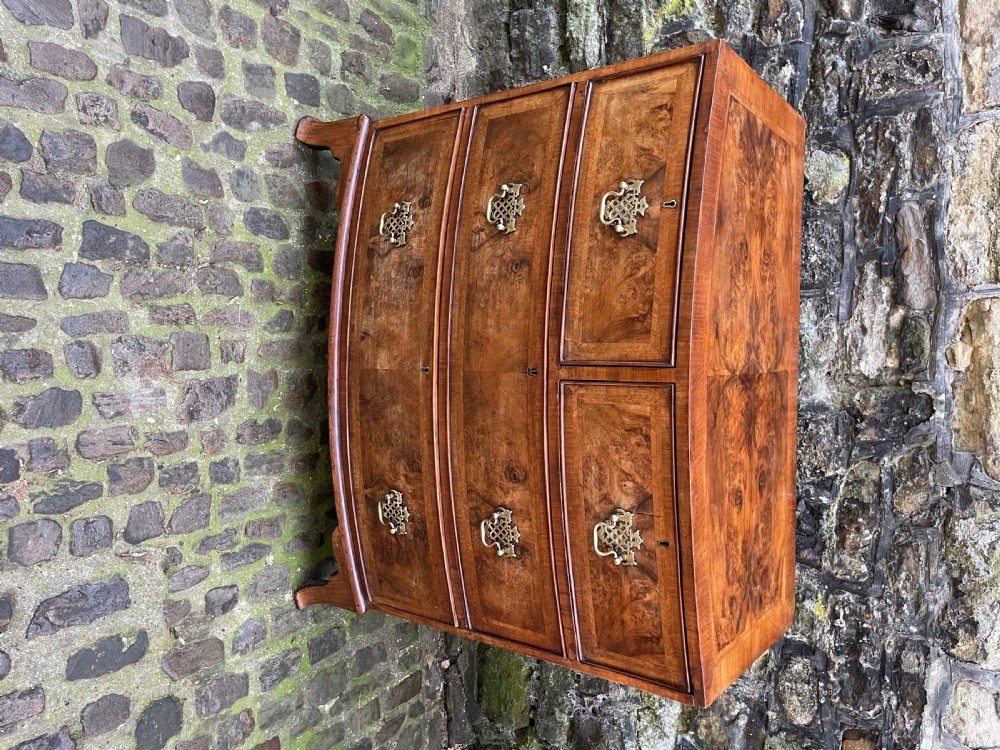 A Regency walnut bowfront chest of drawers View II