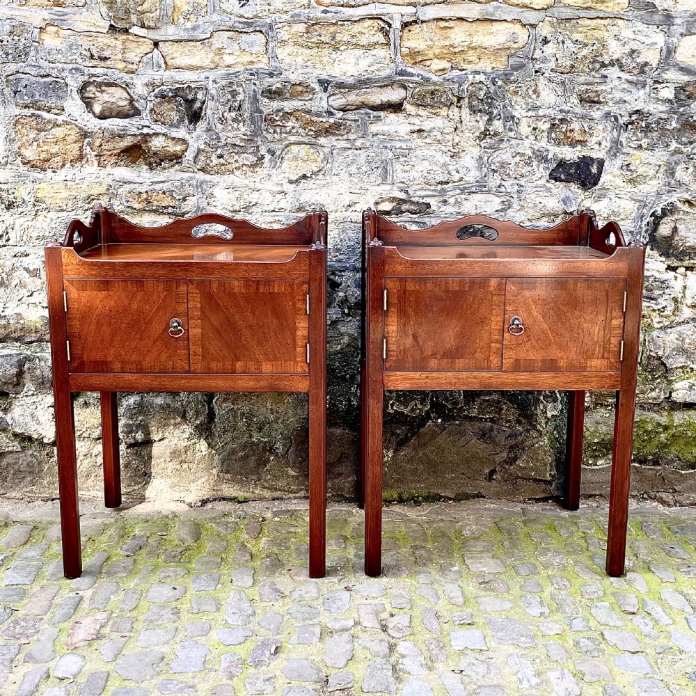 A pair of George III style mahogany bedside tables 