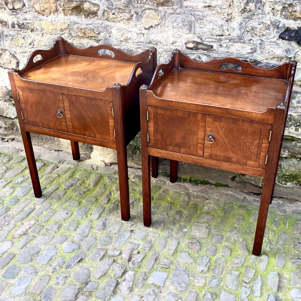 A pair of George III style mahogany bedside tables  View II