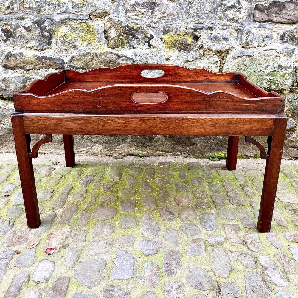 A late 19th century mahogany tray-top coffee table