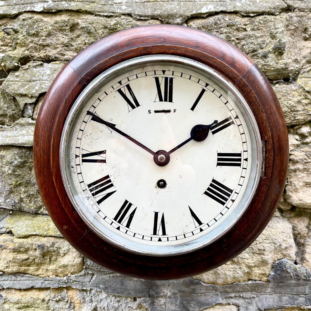 A small early 20th century wall clock