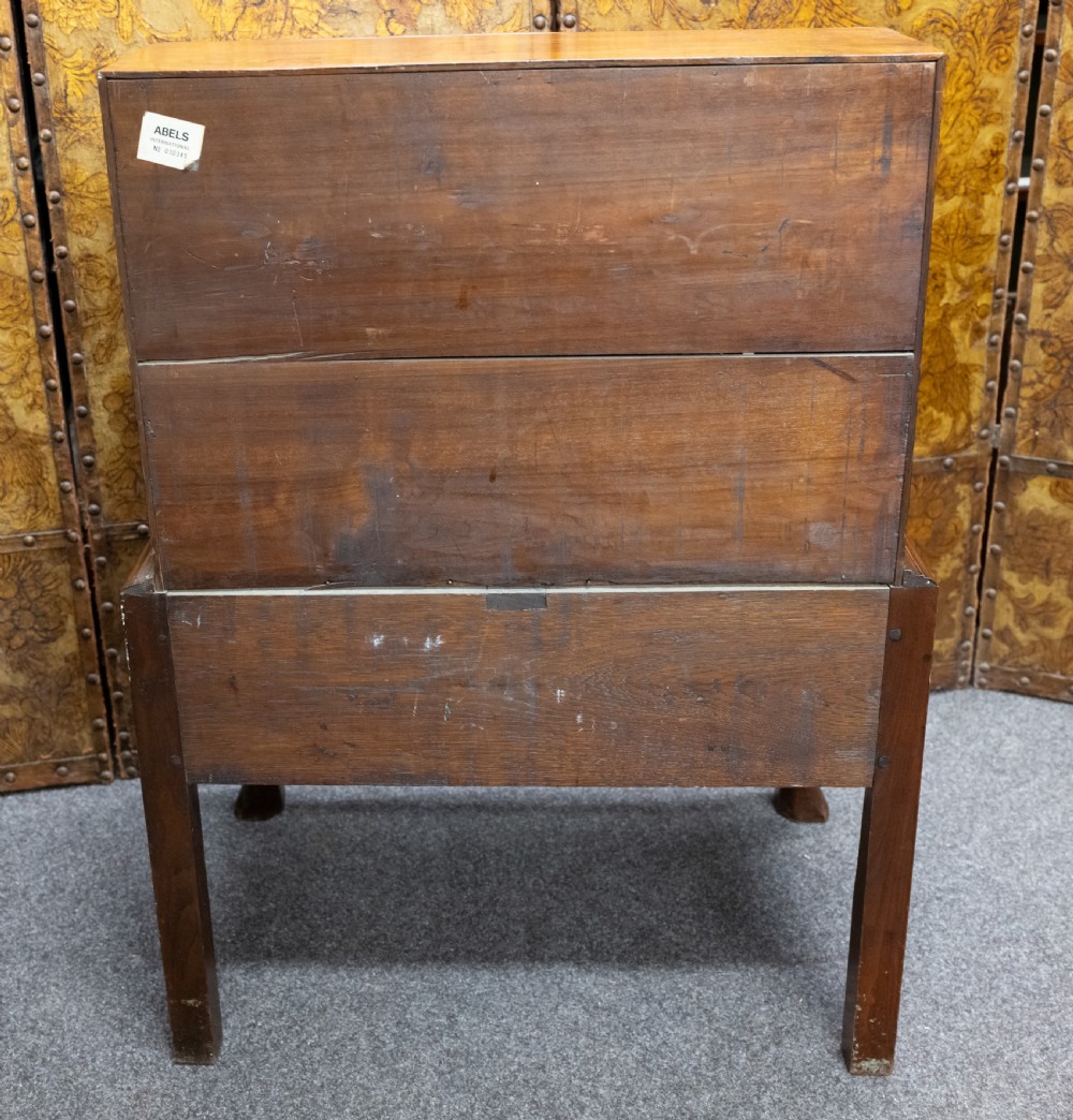 A small solid walnut slant-front bureau featuring a drop-down flap, multiple drawers with brass handles, and cabriole legs. View VII