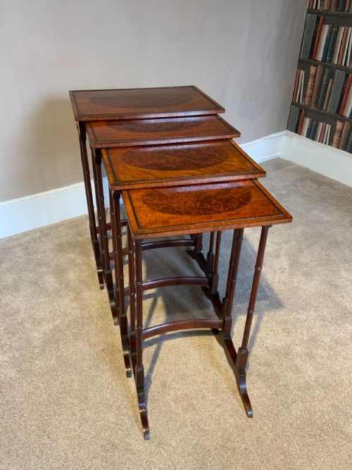 A QUARTETTO NEST OF MAHOGANY TABLES - ADDITIONAL PHOTO 1