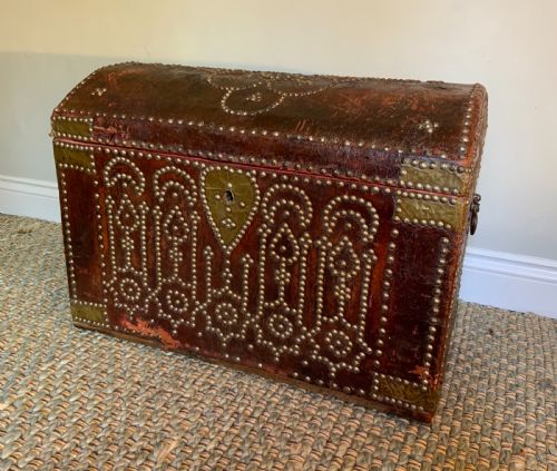 an 18th century red leather travelling trunk - CATEGORY: ANTIQUE CHESTS - DATED 18TH CENTURY