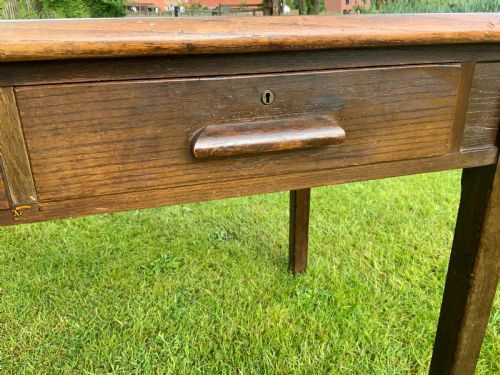 AN OAK TWO DRAWER WRITING TABLE - ADDITIONAL PHOTO 1