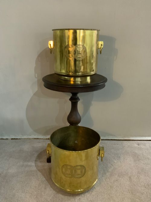 A LARGE PAIR OF POLISHED BRASS PLANTERS