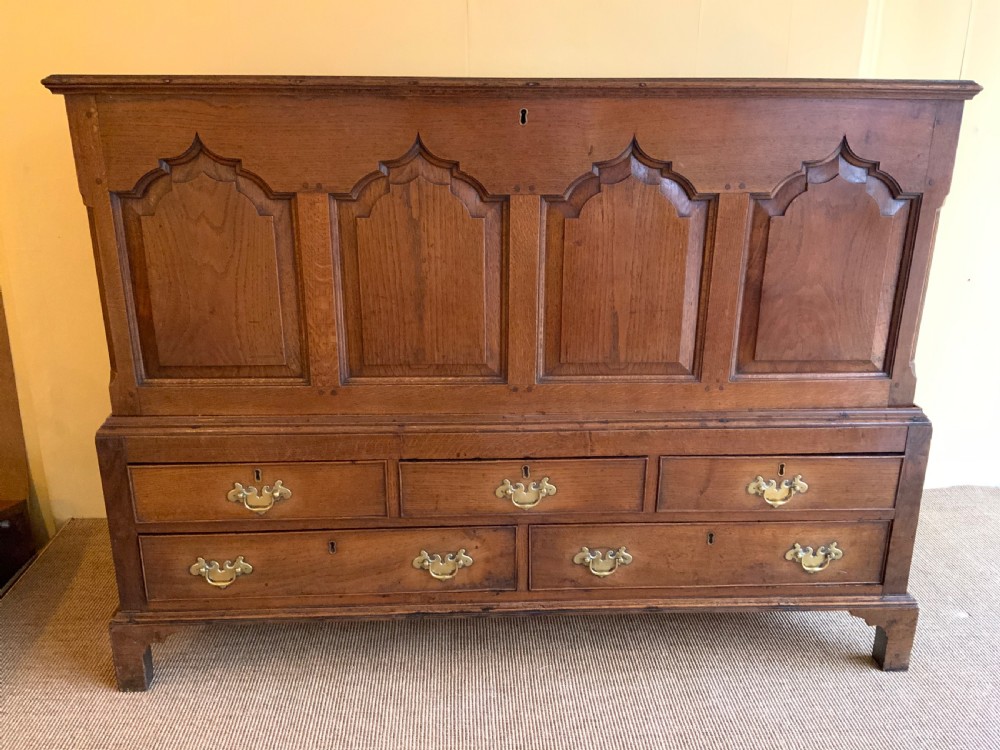 A Georgian oak fielded panel chest