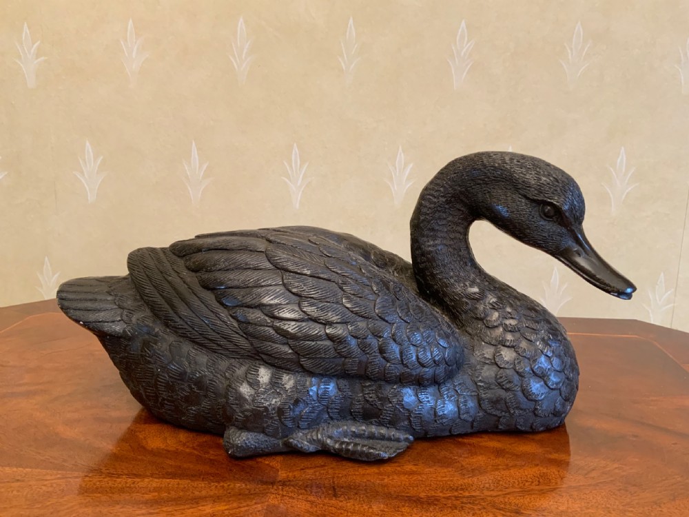 A 19th century bronze sculpture of a duck.