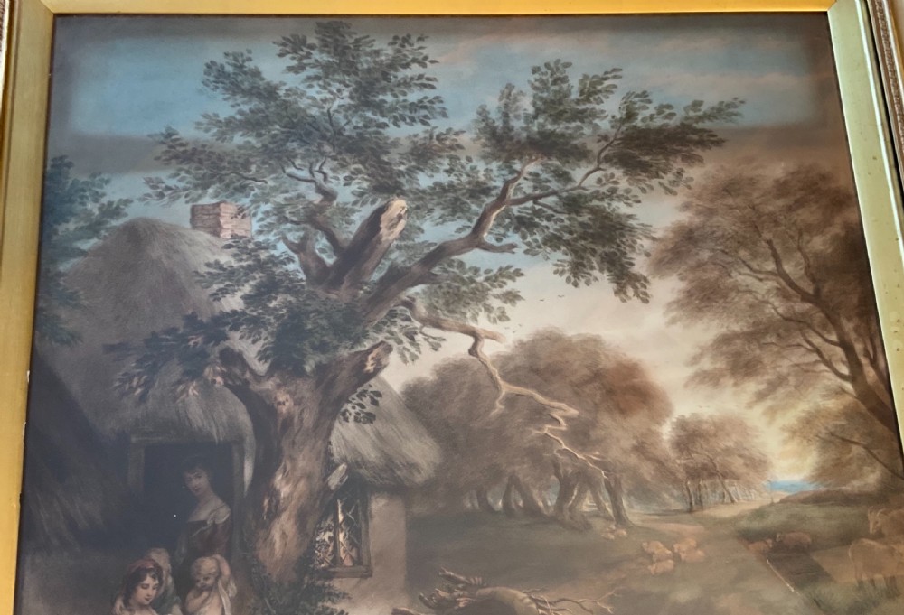 A pair of nineteenth-century mezzotint prints depicting pastoral landscape and cottage scenes, displayed in rectangular giltwood frames with gold slip mounts. View III