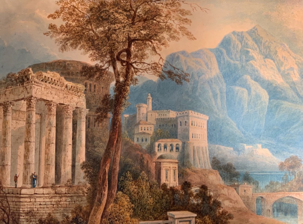 An antique 19th-century watercolour landscape by William Crouch depicting classical ruins, a bridge, and mountains, housed within a pink mount and an ornate gilt frame. View V
