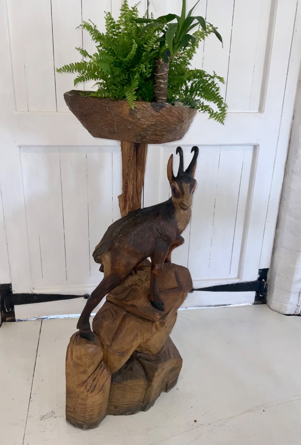 An early 20th century linden wood carved stand View III
