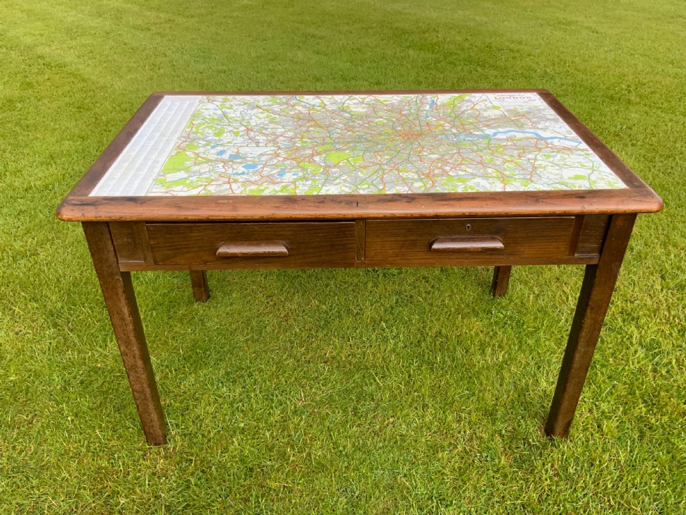 An oak two drawer writing table