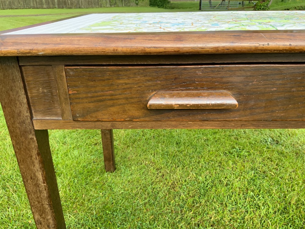An oak two drawer writing table View III