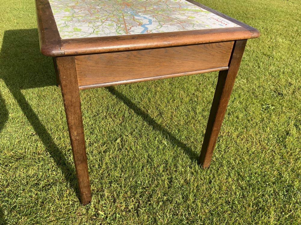 An oak two drawer writing table View X