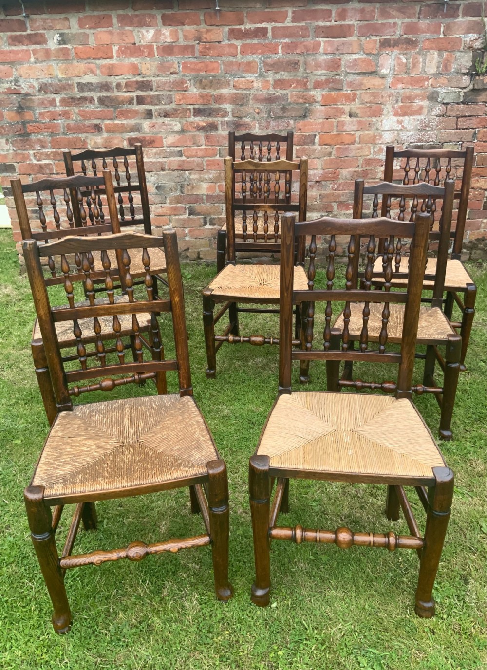 Eight early 19th century elm dining chairs