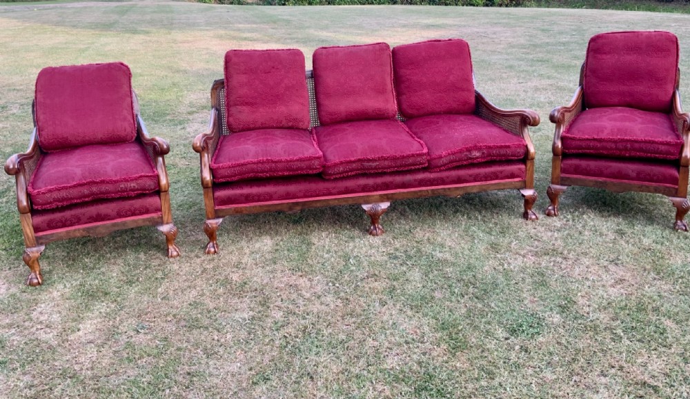 An walnut  bergére settee and pair or arm chairs