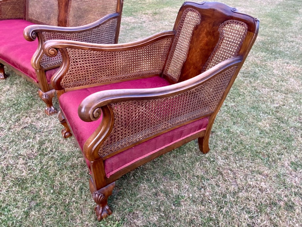 An walnut  bergére settee and pair or arm chairs View II