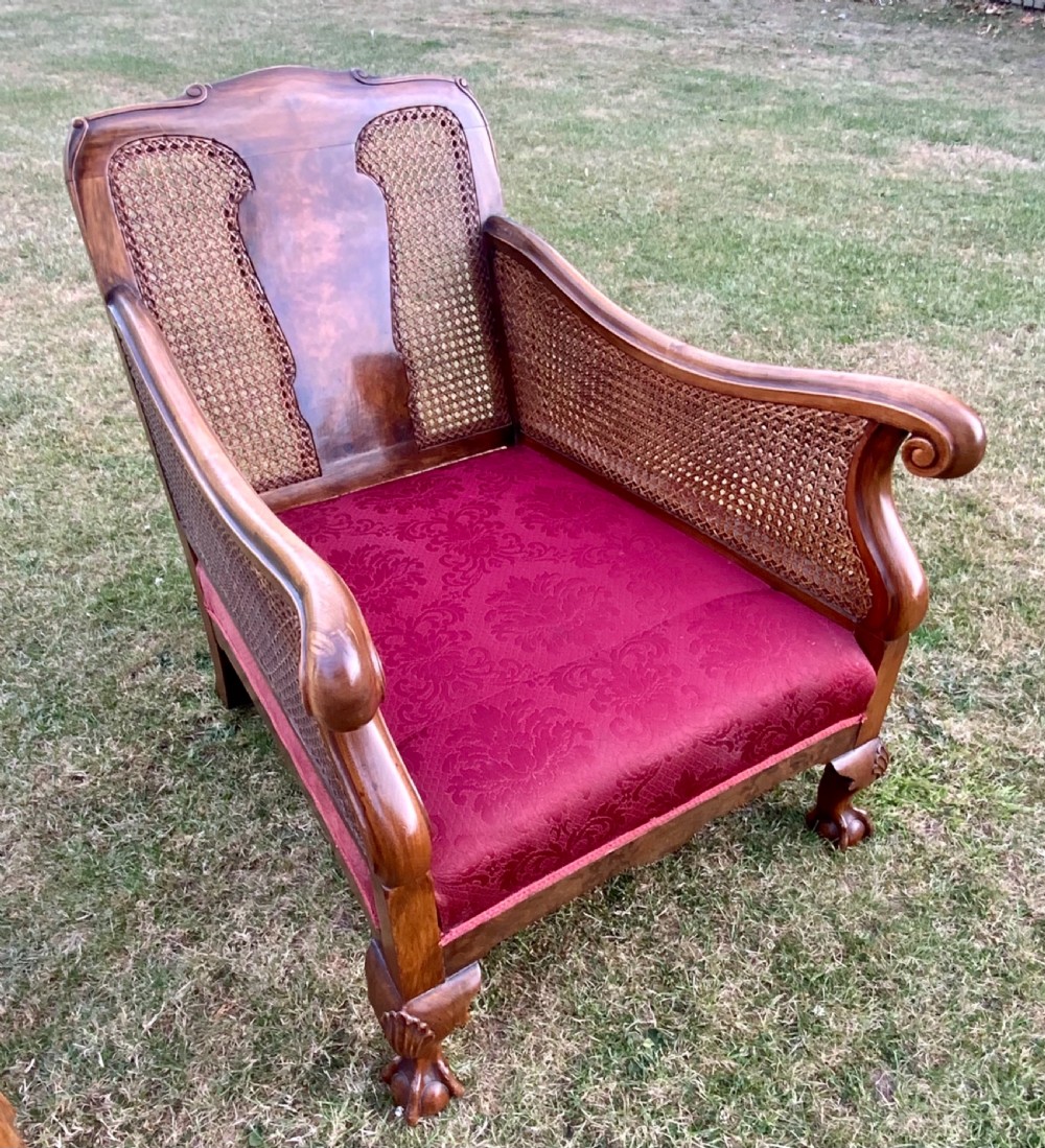An walnut  bergére settee and pair or arm chairs View IV