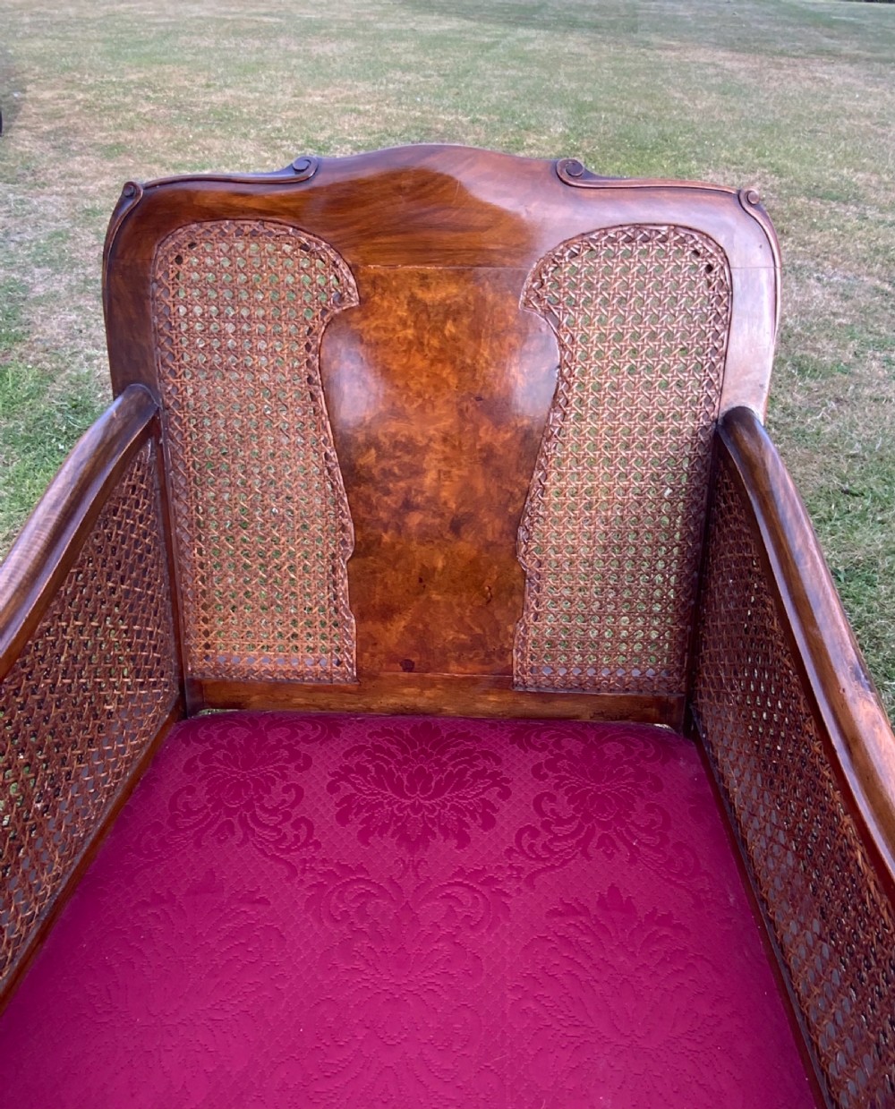 An walnut  bergére settee and pair or arm chairs View V