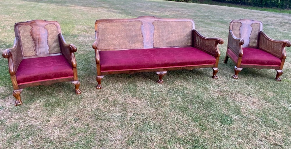 An walnut  bergére settee and pair or arm chairs View X