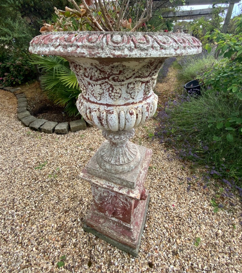 A large terracotta garden urn on plinth View IV
