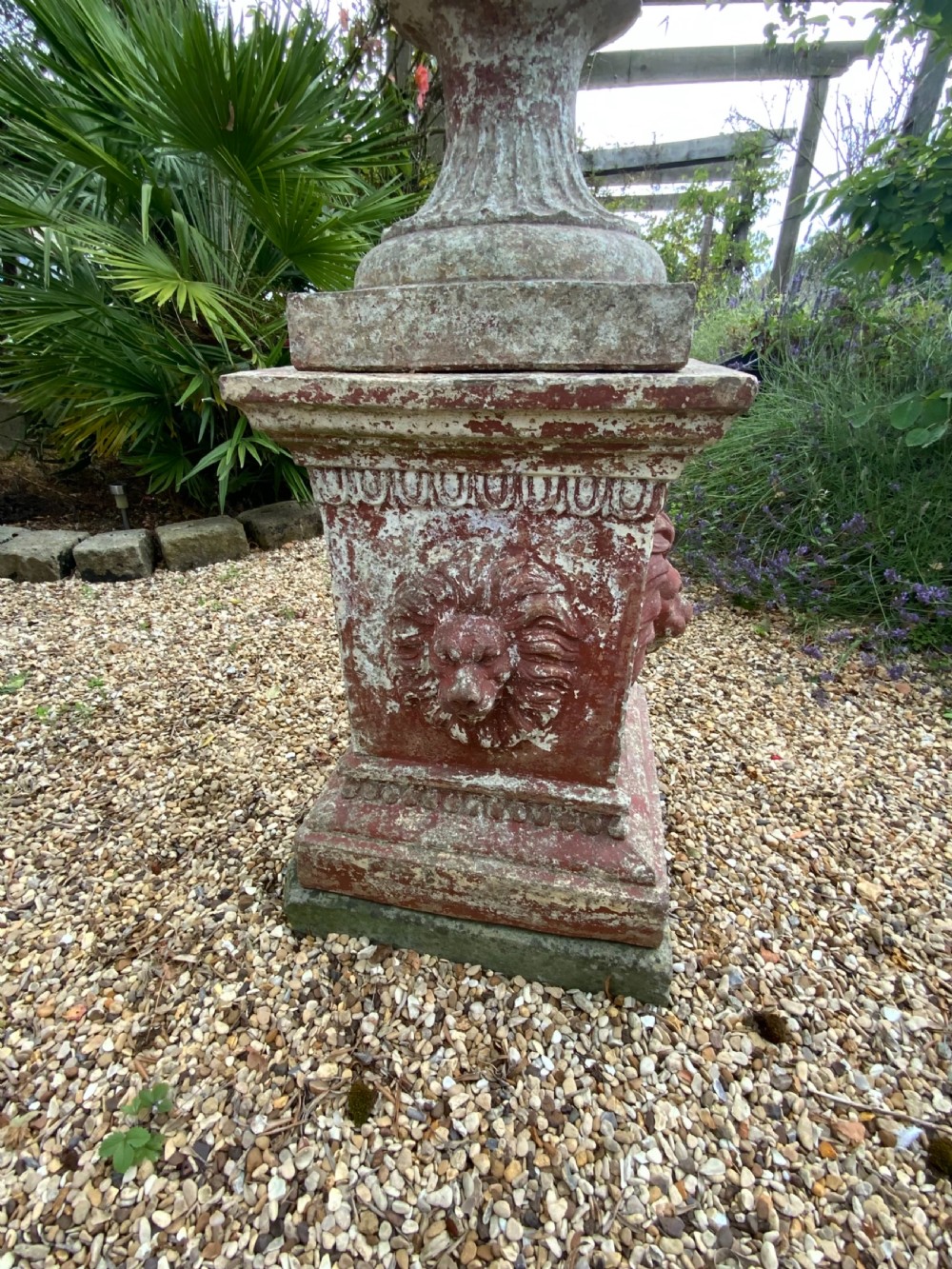 A large terracotta garden urn on plinth View VI