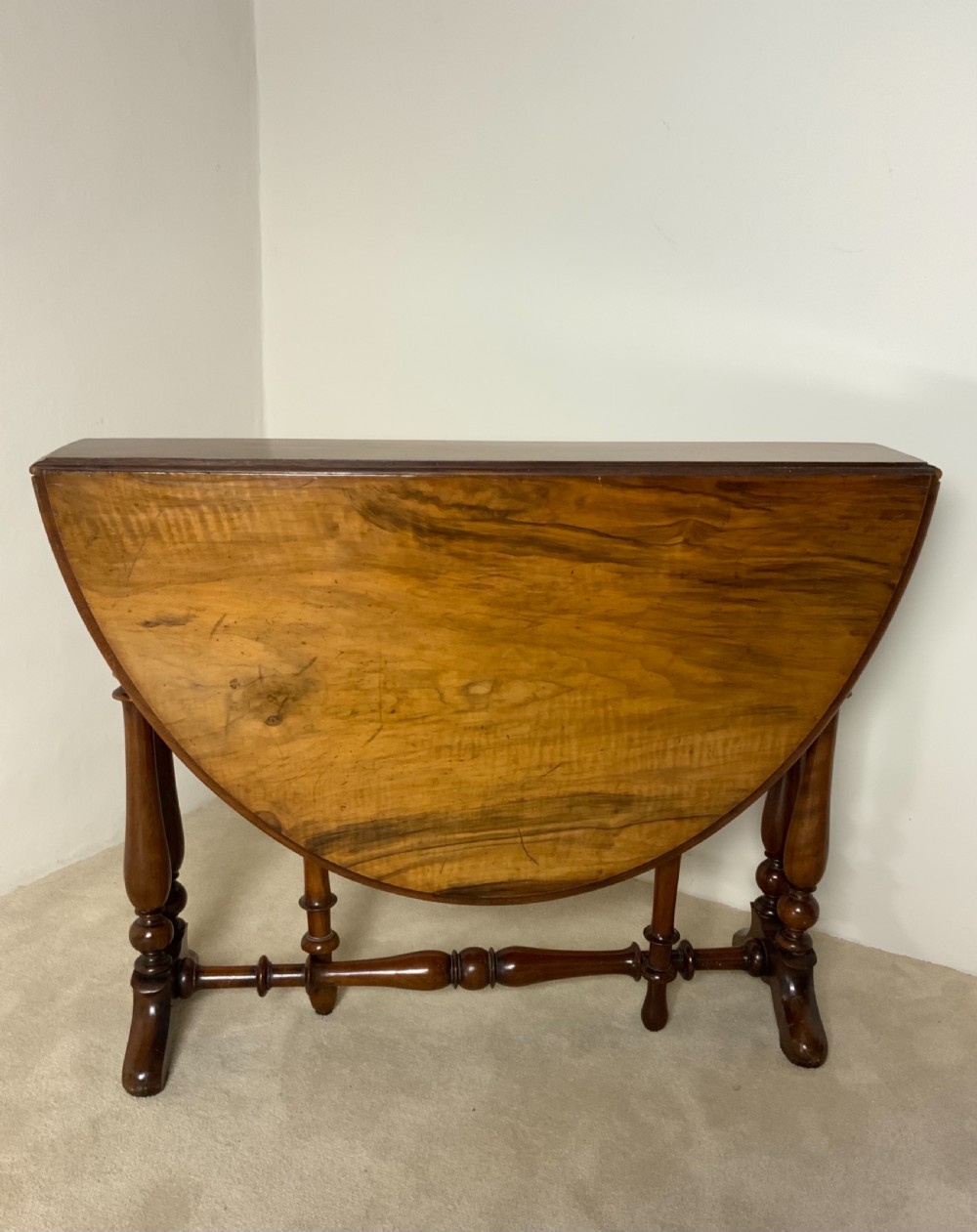 A Victorian walnut Sutherland table