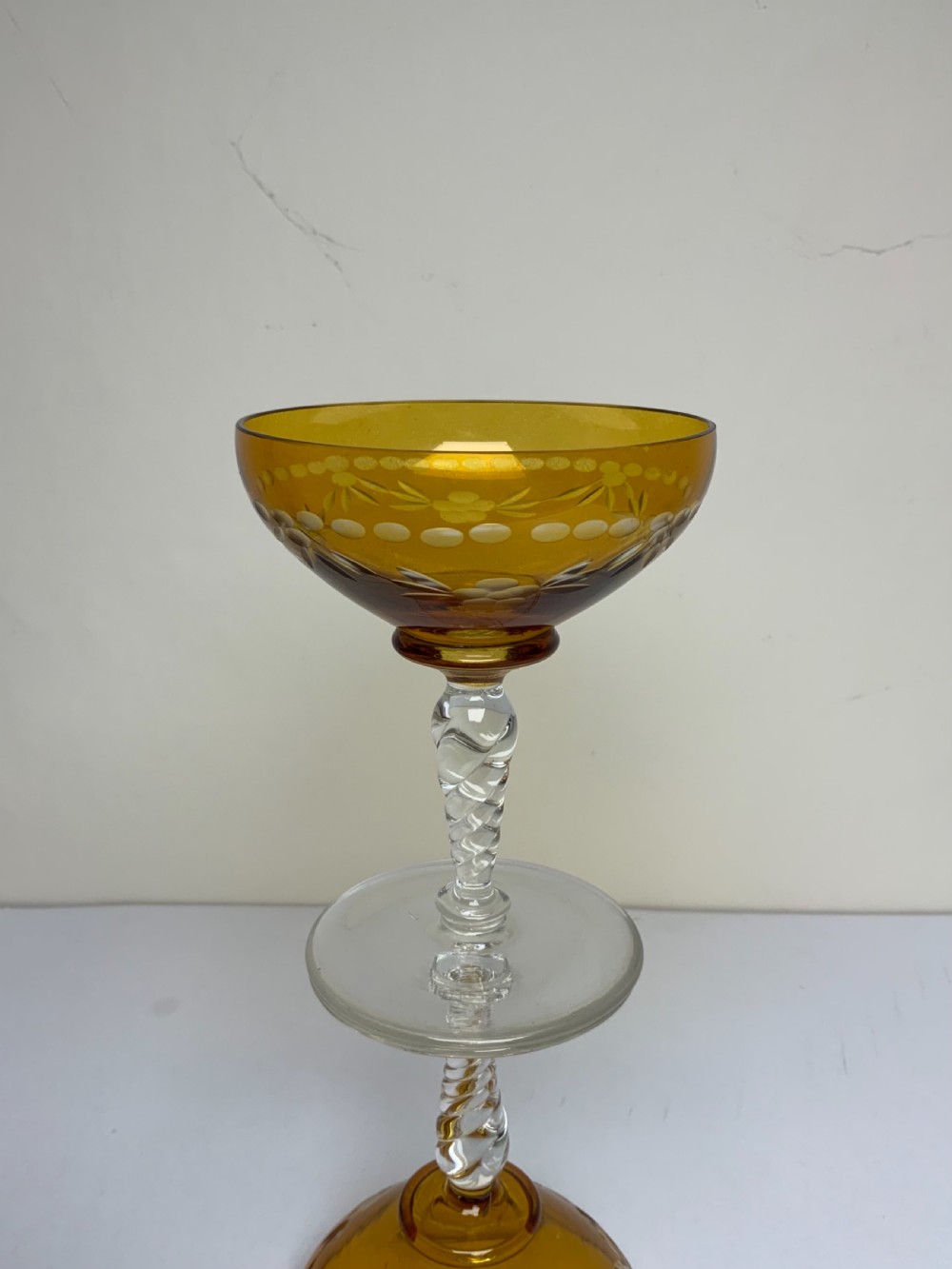 Set six amber coloured champagne glasses View V