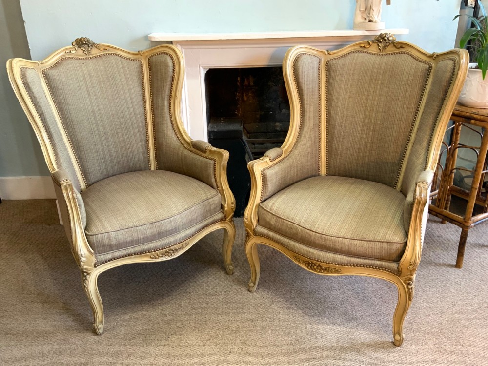 Pair of french wing arm chairs