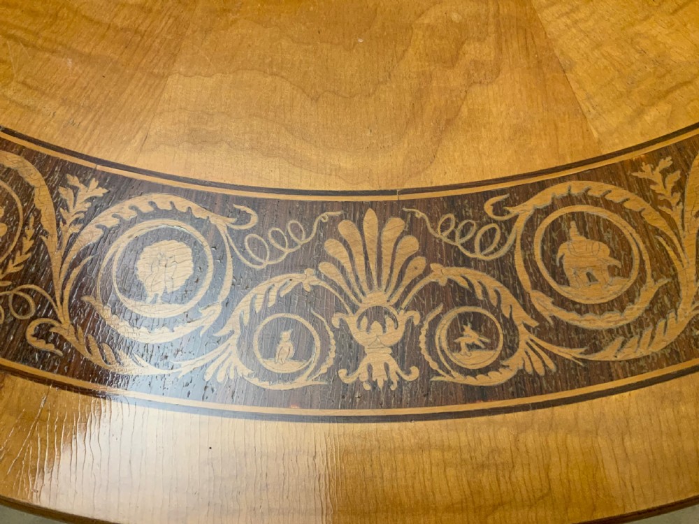 A continental marquetry centre  or drum table View V