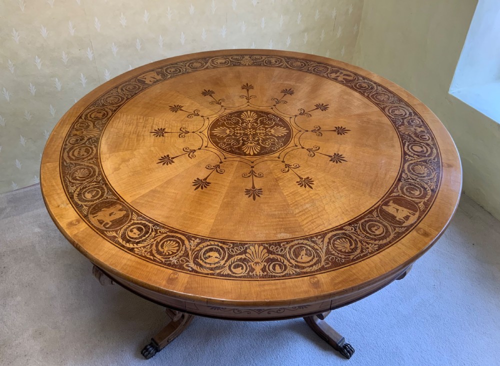 A continental marquetry centre  or drum table View VII