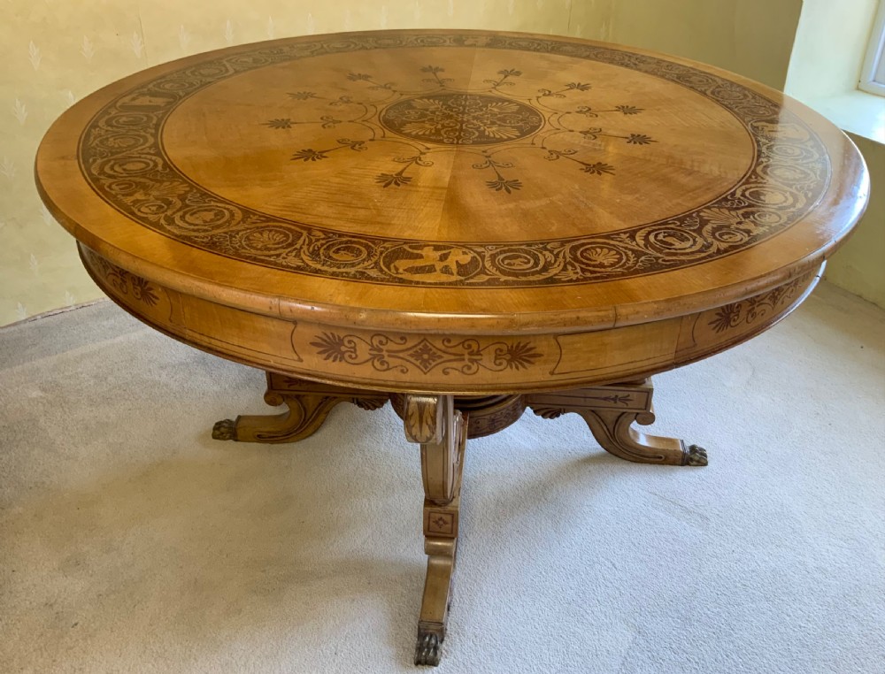 A continental marquetry centre  or drum table