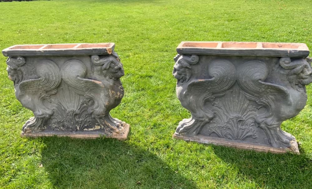 A pair of early 19th century Coade stone table ends