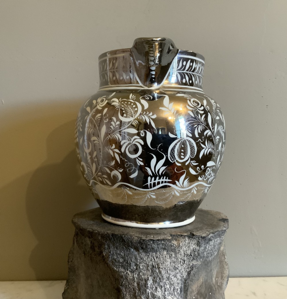 An early 19th century silver resist pottery jug View VI