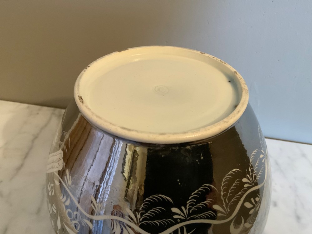 An early 19th century silver resist pottery jug View IV