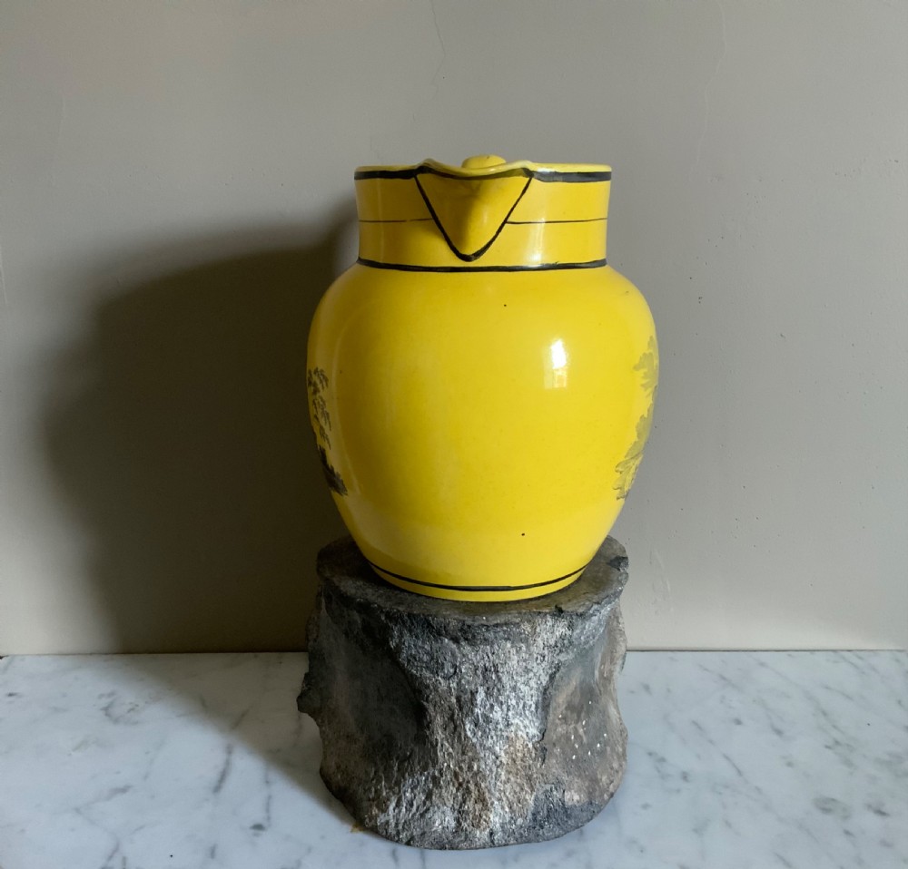 An early 19th century canary yellow pottery jug View III