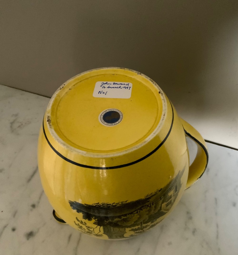 An early 19th century canary yellow pottery jug View IV