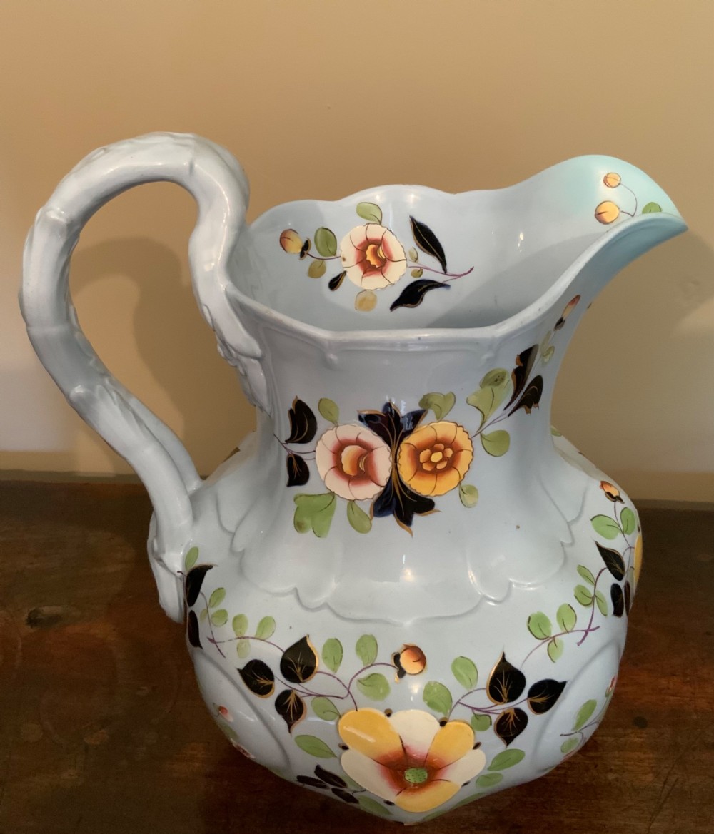 A trio of Pompeii design pottery jugs View IV